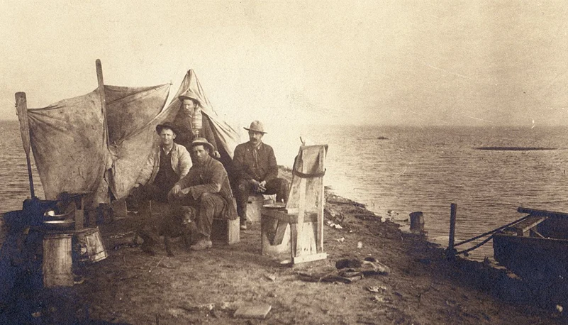A group of men camping at the shores of Tulare Lake, 1880