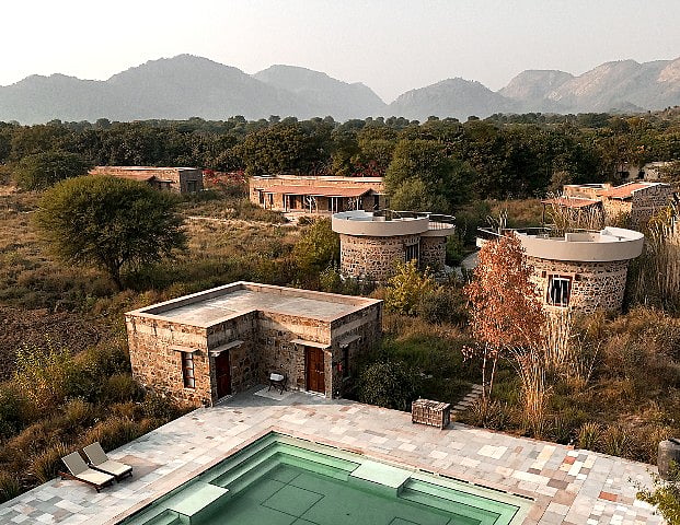 Built using salvaged wood, local stone, and native plants, Sariska Lodge was designed to blend into the land