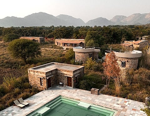 Built using salvaged wood, local stone, and native plants, Sariska Lodge was designed to blend into the land