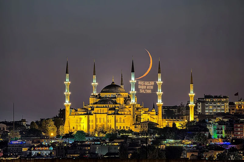 The crescent of Eid seen behind the the Blue Mosque, Turkey (representational image)