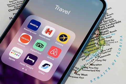 Popular travel booking apps displayed on a smartphone