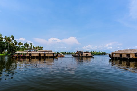Traditional houseboats cruising through Alappuzha’s backwaters