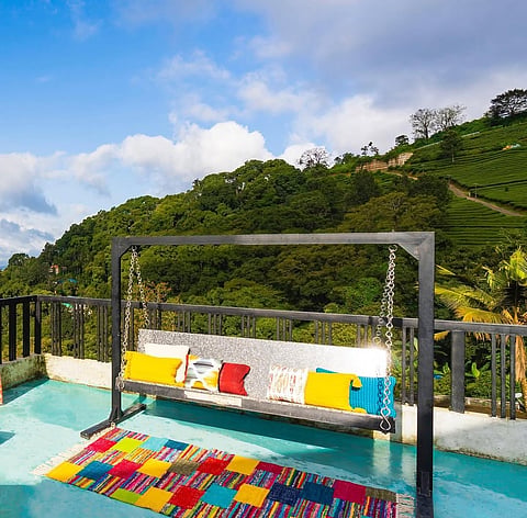 Zostel Munnar is surrounded by tea plantations and rolling hills