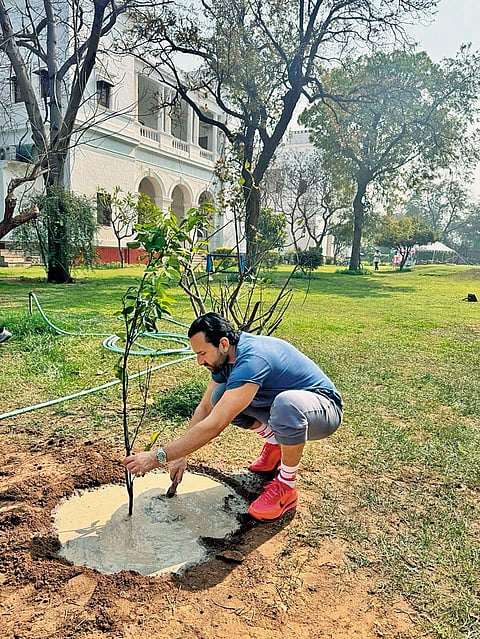Khan planting a tree at Pataudi