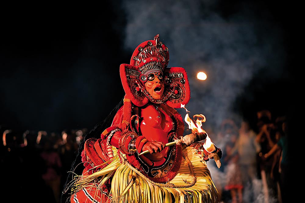 A theyyam artist captivating the crowd