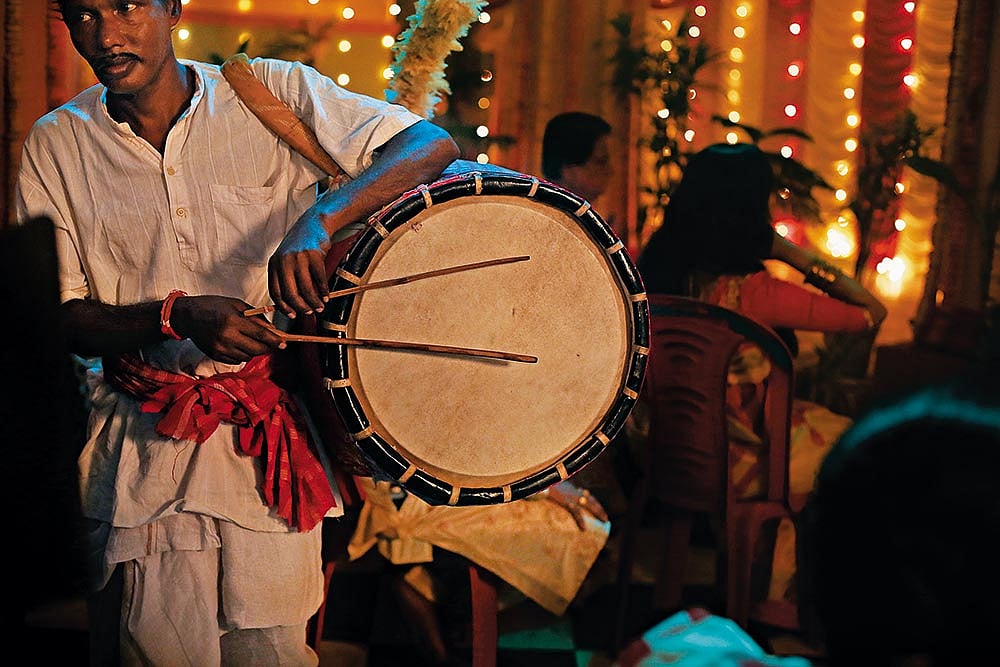 A dhaaki (drummer) during Durga Puja