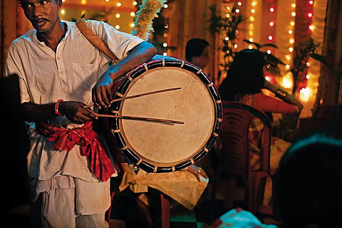 A dhaaki (drummer) during Durga Puja