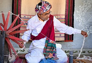 Vankar Chetan : The Vankar family of Bhujodi represents a multi-generational legacy of master weavers in Indias famous craft village of Bhujodi, located just 8 km from Bhuj in Kutch, Gujarat. In frame: Chaman Siju, National Award-winning Bhujodi weaver (2001) and uncle of Vankar Chetan, preparing yarn using a traditional spinning wheel.