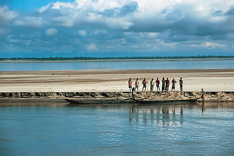 Brahmaputra River/Assam:
Seen from a river cruise, local people move along the Brahmaputra, one of Asia’s great transboundary rivers and a lifeline for transport, trade, farming, fishing and floodplain communities