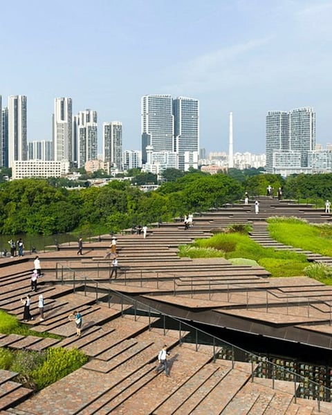 The historic slope has been extended into a stepped roofscape that visitors can walk across while overlooking the riverfront.
