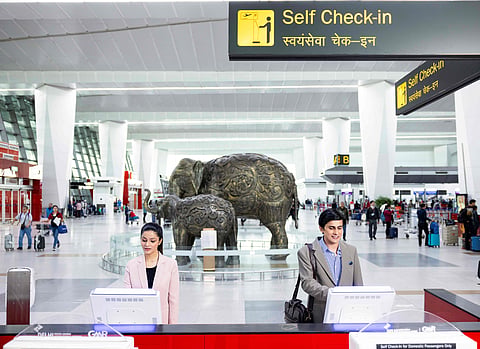 Passengers at self check-in desk at Delhi Airport T3