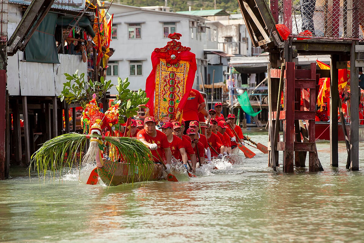 Dragon boats parade through Tai Os waters during the Dragon Boat Festival 