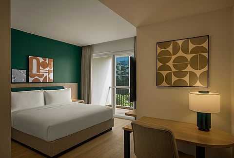 A Standard King room with a balcony at Spark by Hilton Bengaluru