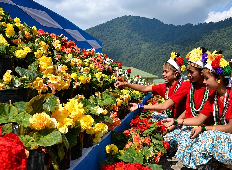 Phool Dei celebrations in Uttarakhand, where children decorate doorsteps with fresh spring flowers while singing traditional blessings for happiness and a bountiful harvest.