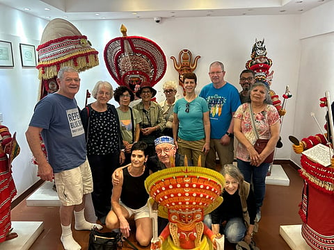 Tourists with Theyyam performers 