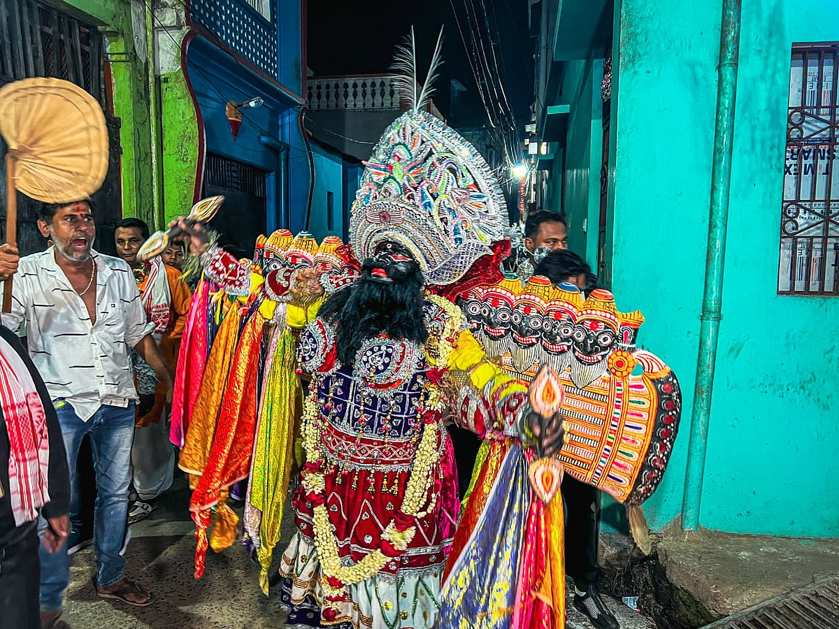 The performer portraying Ravana captivates spectators as he makes his way through the streets of Balisahi