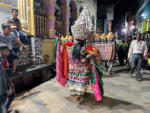 Ravana performing on the streets of Balishahi, entertaining the community people