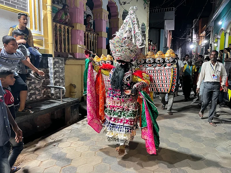 Ravana performing on the streets of Balishahi, entertaining the community people