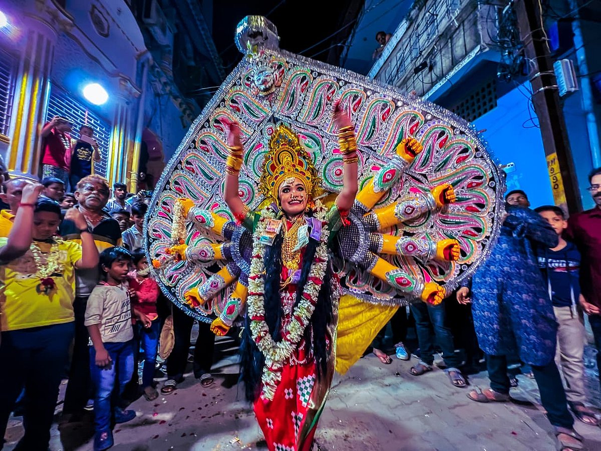 A child performer dressed as Durga Medha - Goddess Durga, dressed on Tatti- Shola Pith