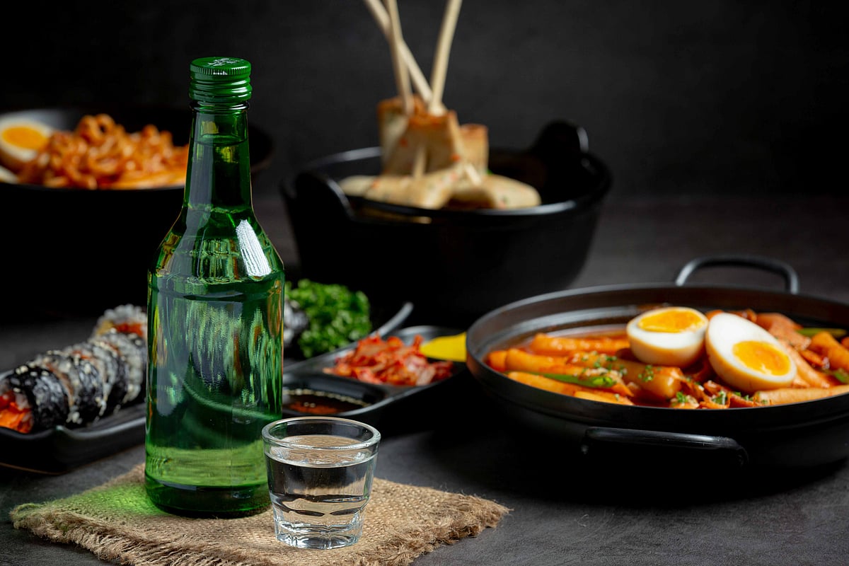 Shutterstock : Soju paired with classic Korean side dishes for an authentic dining experience