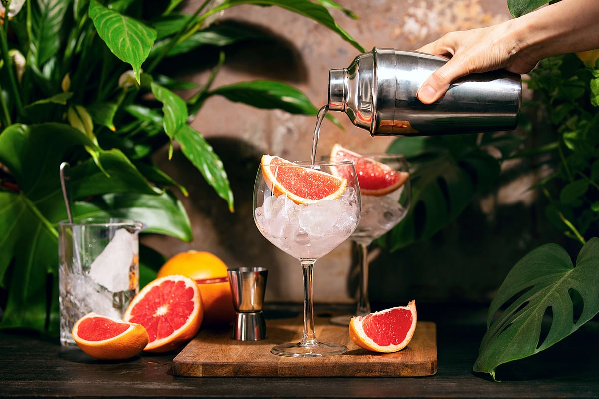 Shutterstock : A mixologist prepares a pink grapefruit and rosemary gin cocktail (representative only)