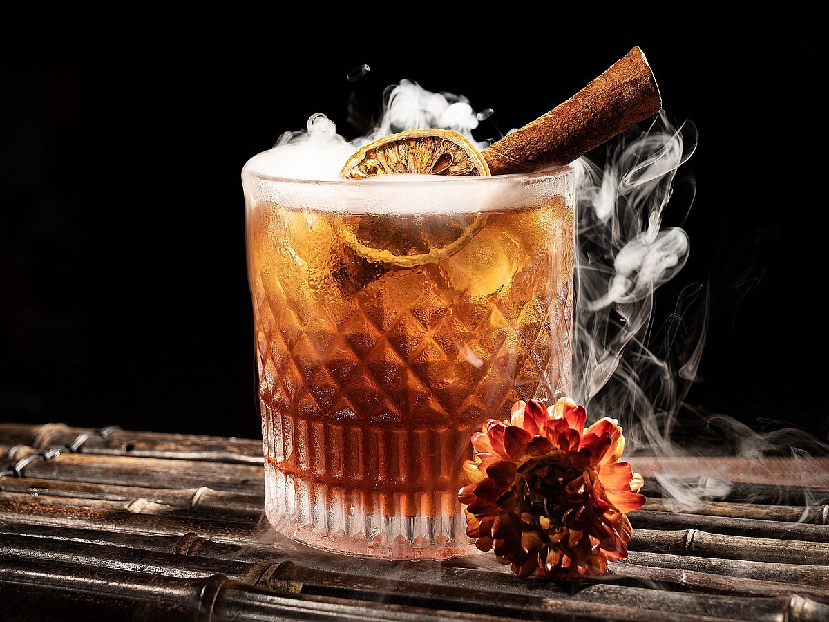 A cocktail with smoke and cinnamon 