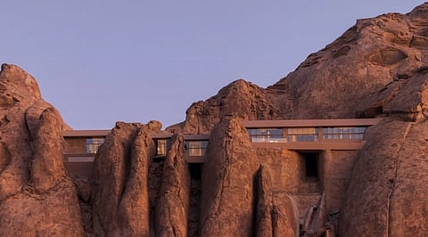 Carved into ancient granite cliffs, Desert Rock Resort merges seamlessly with Saudi Arabia's dramatic desert landscape through its understated architectural design.