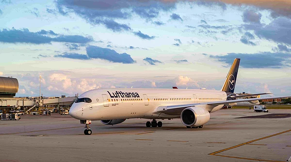 Shutterstock : A Lufthansa Airbus A350 at an airport terminal