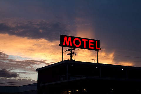 Retro motel sign at sunset in Denver (For Representational Use only)