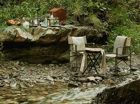 A streamside picnic setup near the retreat