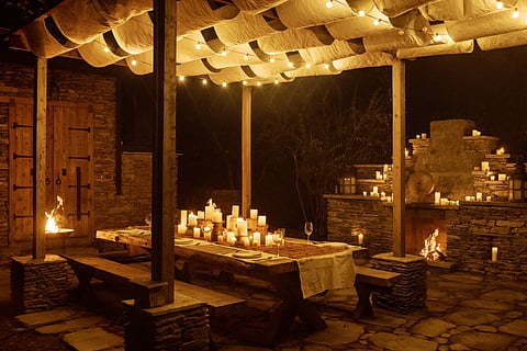 An outdoor candle-lit dining setup at The Sen