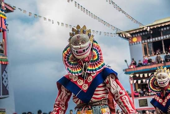 Monks perform a traditional masked dance during Torgya in Tawang