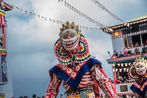 Monks perform a traditional masked dance during Torgya in Tawang