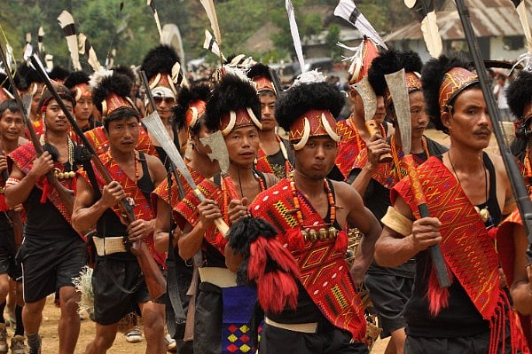 Men in traditional Konyak attire take part in a ceremonial march during the Aoleang Festival