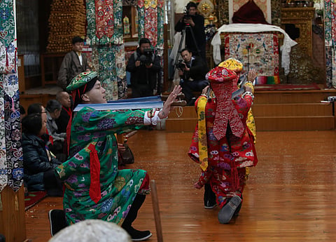 Ladakhi Buddhists make religious offerings before their deities in local monasteries 