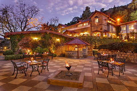 The Naini Retreat combines its former palace setting with Kumaoni cuisine, local art experiences, and views towards Naini Lake