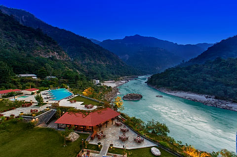 Aloha On The Ganges offers riverside stays with yoga, spa treatments, regional Uttarakhand cuisine, and evening flute performances