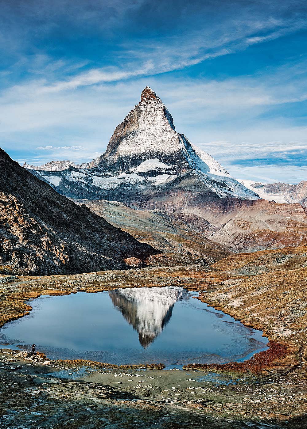 Riffelsee Lake, at 2,757 m, offers a striking reflection of the Matterhorn