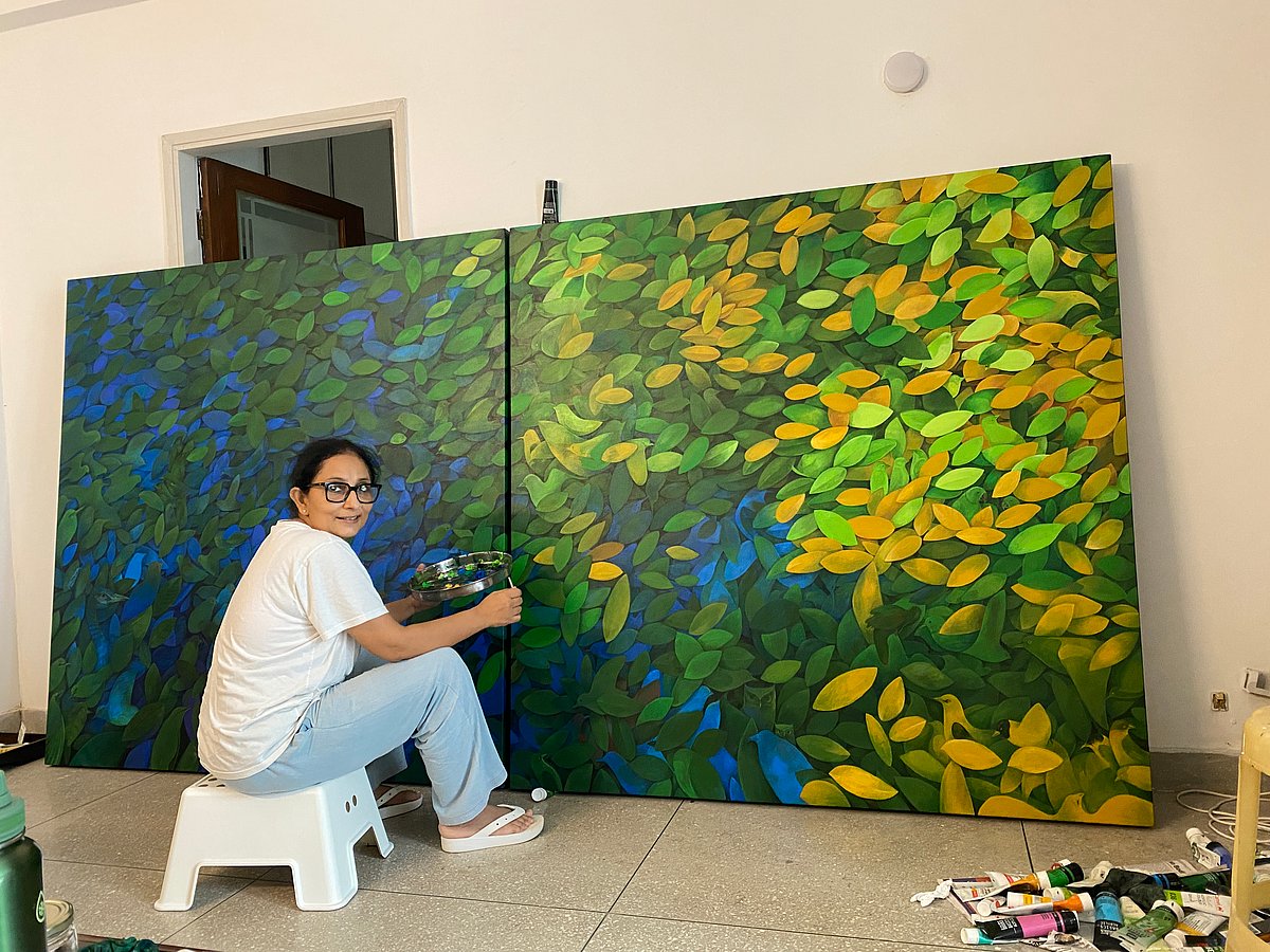 Rupa Samaria with one of her paintings