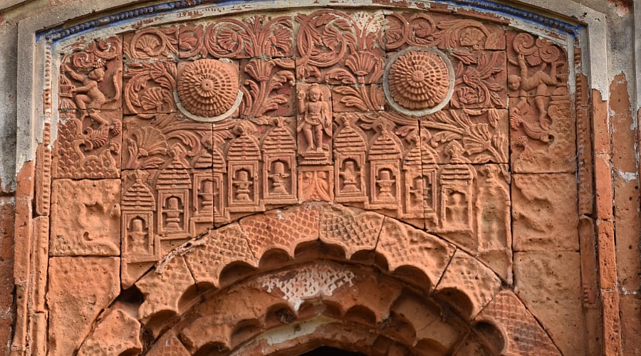 Terracotta panels on arch of Aatchala temple in a cluster of three temples at Masagram of Purba Bardhaman district
