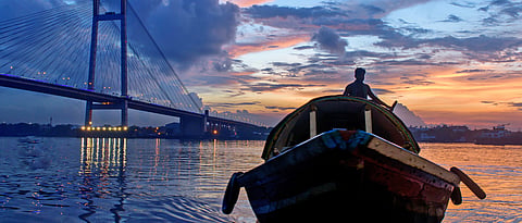 A boat on the Hooghly river at sunset