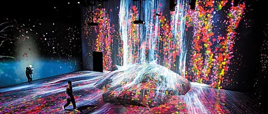 A simulation of a waterfall that plunges into a floral universe
