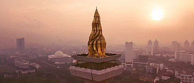 The Flame of Independence at the Monas Tower, which is illuminated in the night.