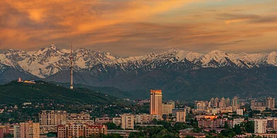 Almaty city and the Zailiyskiy Alatau mountain range at sunset Credit Max Zolotukhin / Shutterstock