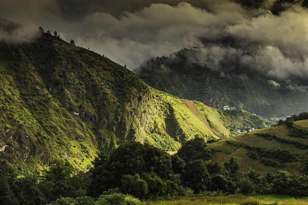 High mountains and deep valleys shrouded in clouds near Tawang in Arunachal Pradesh
