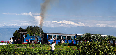 The toy train at the Batasia Loop with a backdrop of the mighty Kangchenjunga