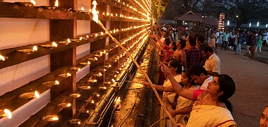 People light diyas in Vadakkumnathan temple in Thrissur