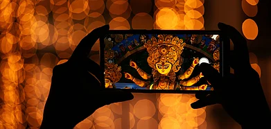 Shutterstock : The idols are placed on a boat and taken to the middle of the river for the immersion