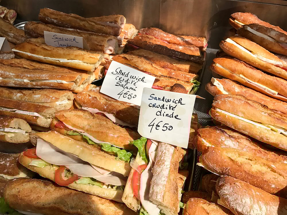 Fresh French baguettes for sale in a window in Paris, France                                            Shutterstock
