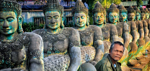 Sculptures lined along an entrance to Angkor Thom
